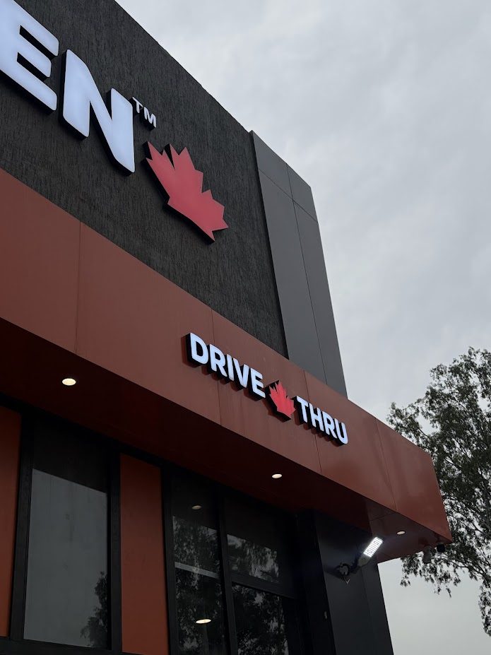 MB Chicken storefront with drive-thru signage