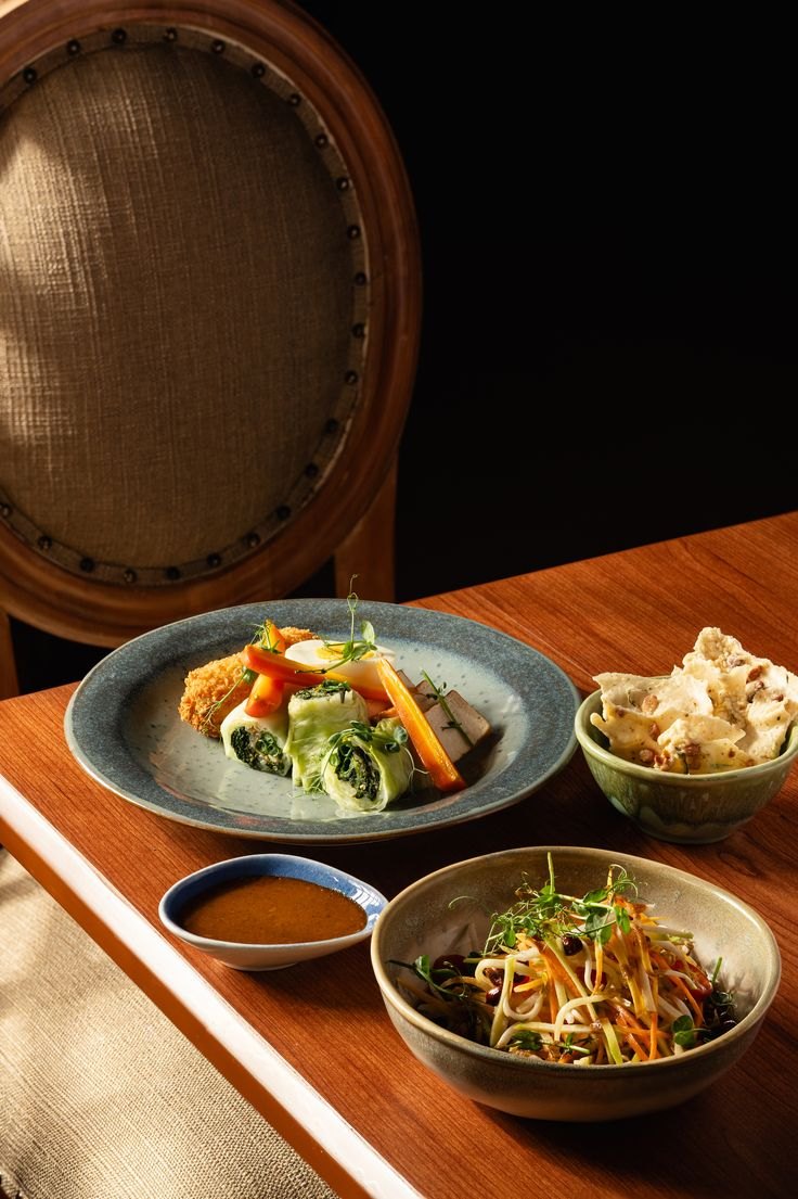 Plated fine-dining dishes on a restaurant table